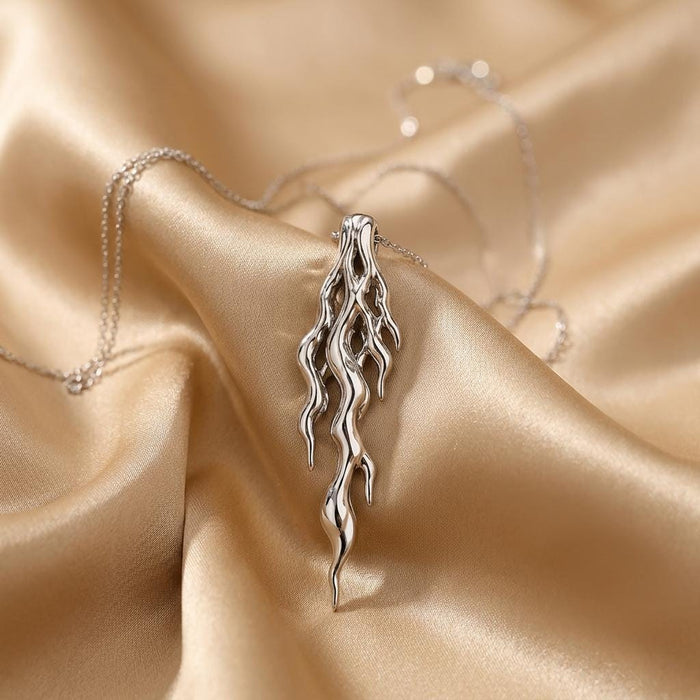 Silver Molten Vein Pendant Necklace with cascading openwork pendant on champagne satin