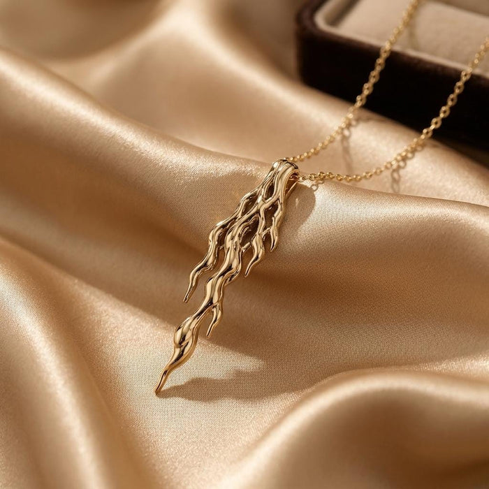 Gold Plated Silver Molten Vein Pendant Necklace close-up on champagne satin
