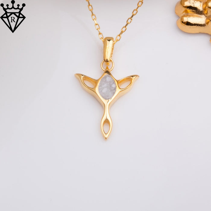 Moonstone Elf pendant on a white surface with a gold-colored background prop