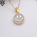 Close overhead product image of a round moonstone smiley pendant on a chain