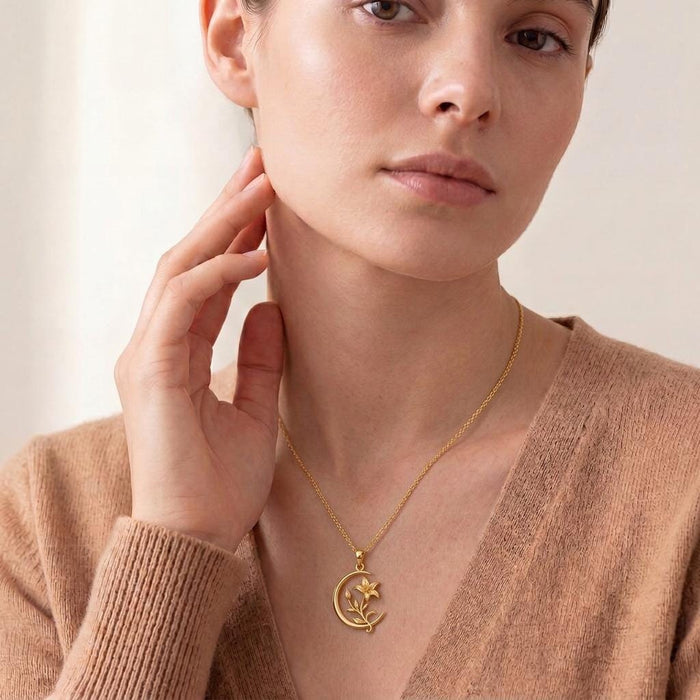 Moonvine Lily necklace worn at the neckline with a soft knit V-neck top