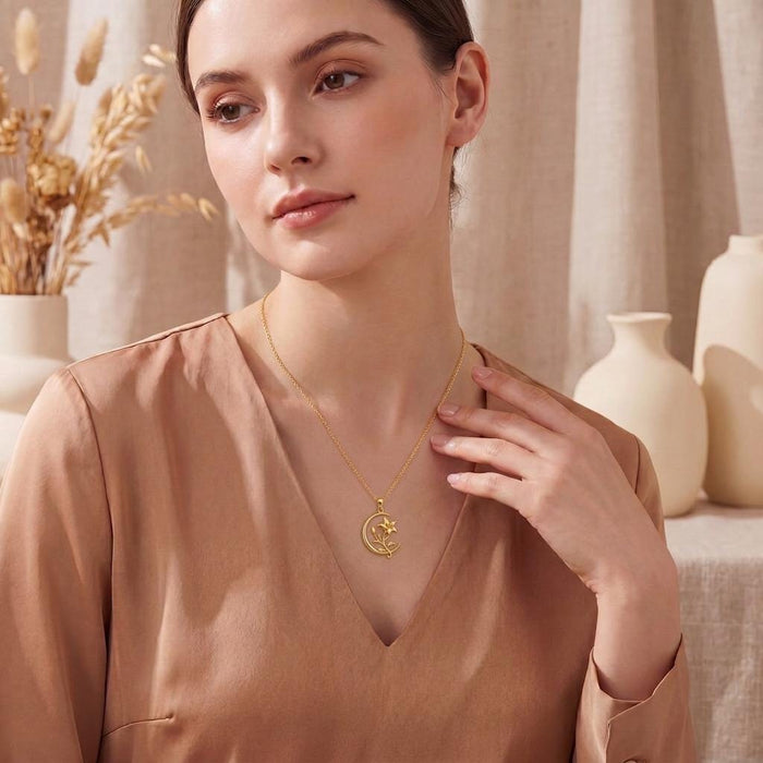 Moonvine Lily necklace worn with a satin V-neck blouse in a neutral interior