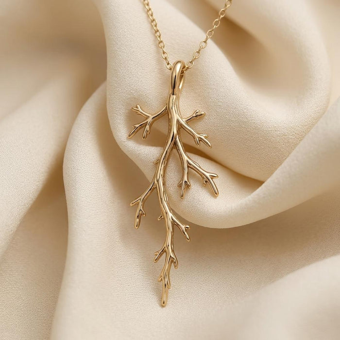 Gold Plated Silver Mystic Forest Branch Pendant Necklace arranged on ivory satin