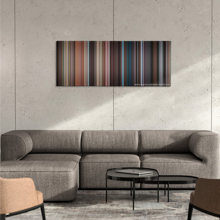 No Strings Attached color palette canvas on a concrete wall above a gray sectional sofa