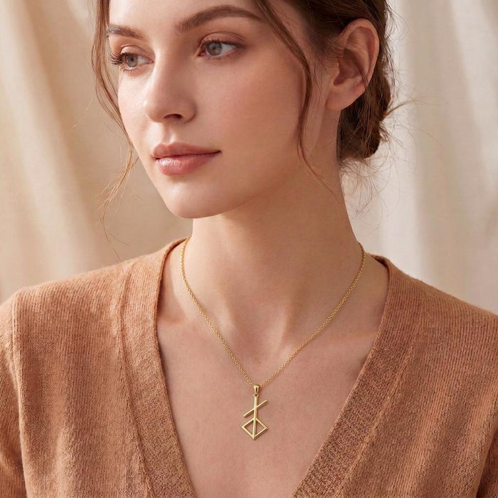 Gold Plated Silver Norse Renewal Symbol Necklace worn at the collarbone