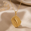 Gold Plated Silver Opabinia fossil pendant necklace with raised segmented relief on champagne satin