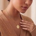 Gold Plated Silver Orobas Sigil Necklace worn with a brown knit cardigan