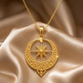 Gold Plated Silver Ottoman Crescent Necklace with an eight-point star on champagne satin