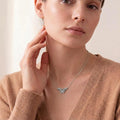 Patterned Butterfly Necklace in 925 sterling silver worn with a tan knit top
