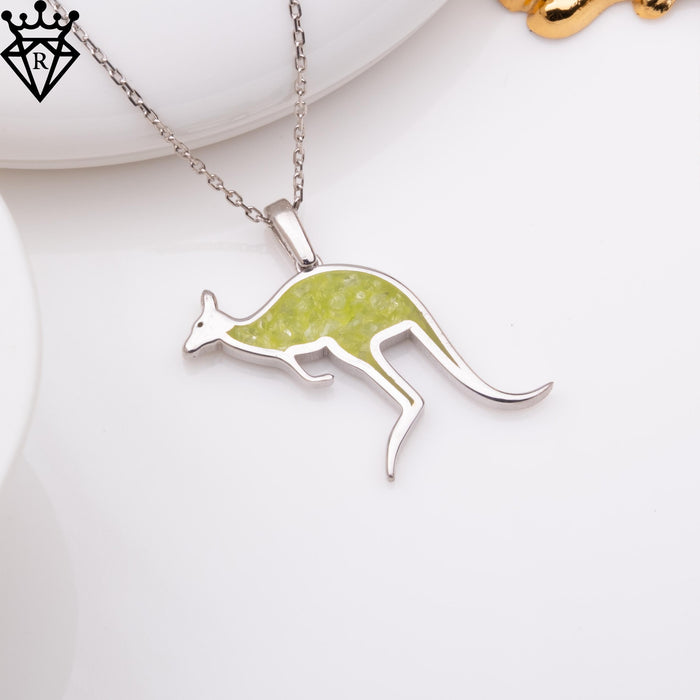 Top-angle product image of a green-inlay leaping kangaroo pendant on a white surface