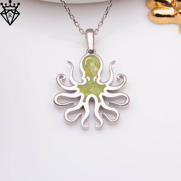 Front product close-up of an octopus pendant on a light background