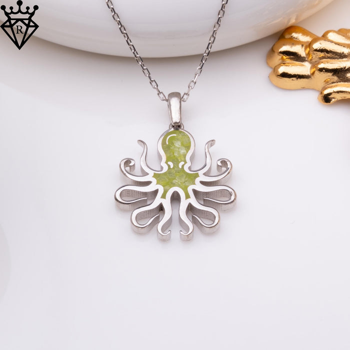 Centered product view of the octopus pendant on a light styled background