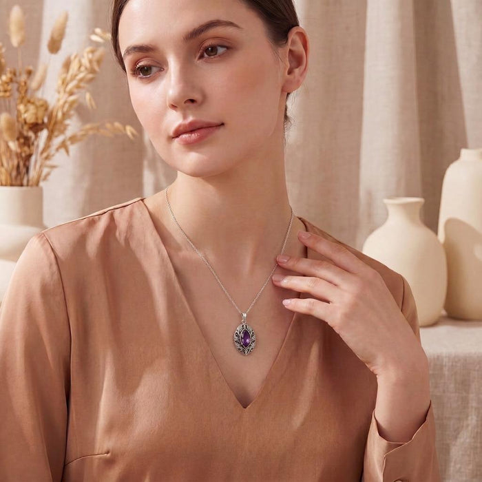 Model wearing the Personalized Elven Amethyst Necklace with a violet marquise-shaped pendant and leaf-detailed frame