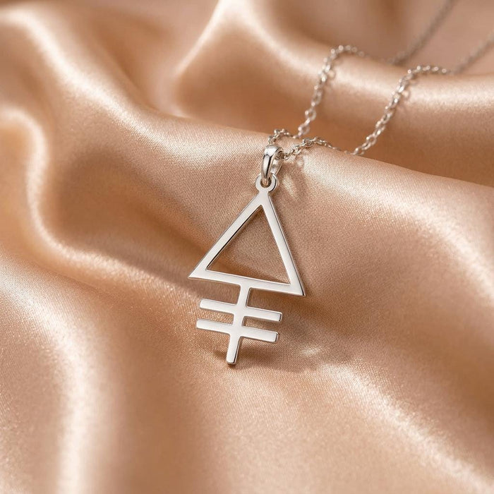 Close-up of the open triangle Phosphorus symbol pendant on champagne satin