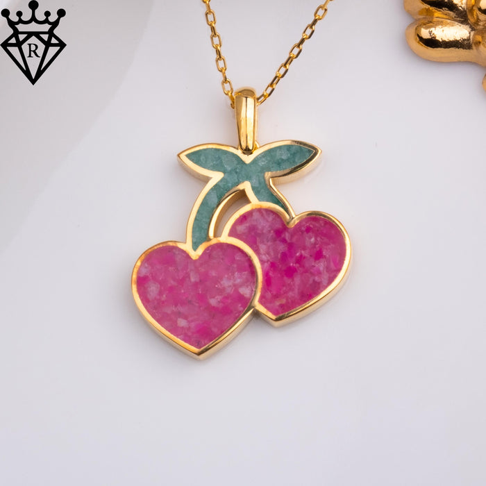 Front product image of a pink agate double-cherry pendant on a gold-tone chain