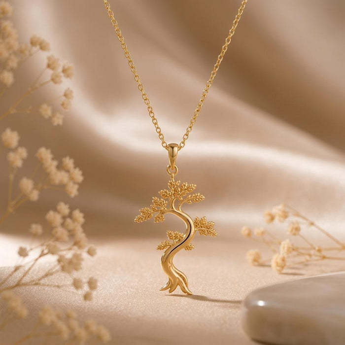 Gold Plated Silver Juniper Flame Pendant Necklace with textured tree on champagne satin and dried flowers