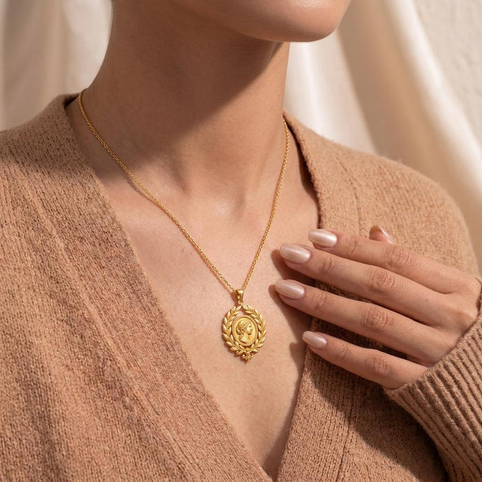 Gold Plated Silver Roman Laurel Pendant Necklace worn over a beige knit neckline