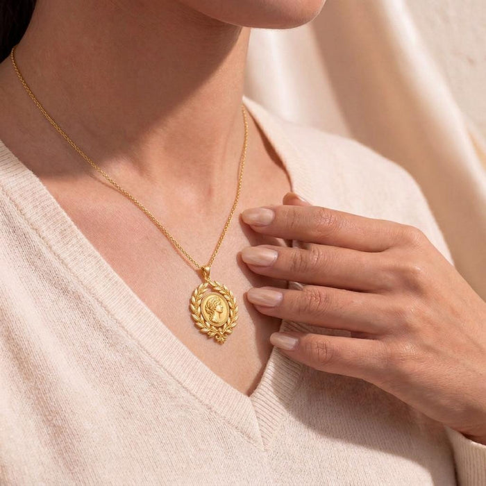 Gold Plated Silver Roman Laurel Pendant Necklace worn with a light knit top