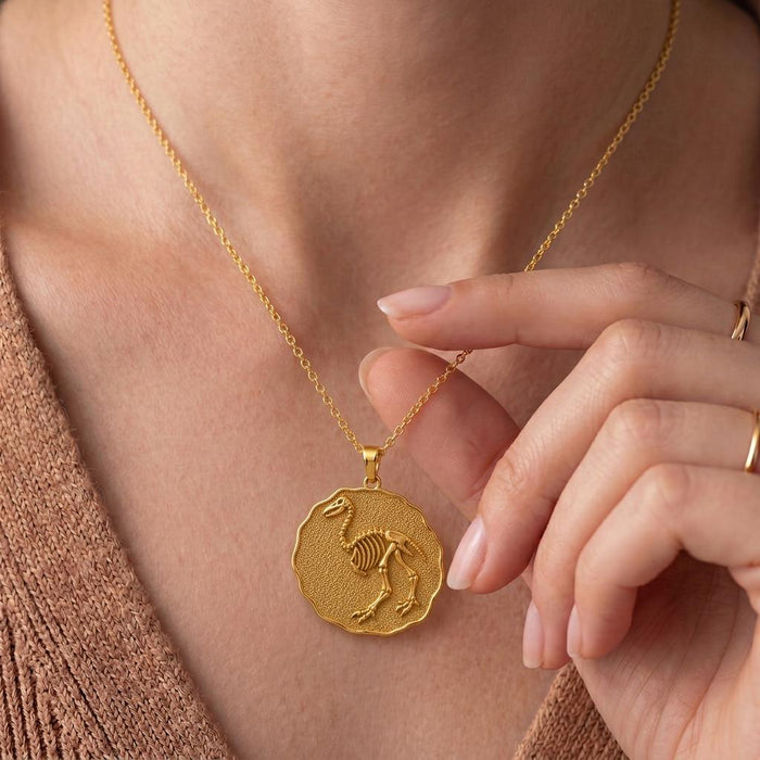 Close view of a model holding a Gold Plated Silver Aepyornis Fossil Pendant Necklace