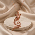 Rose Gold Plated Sacred Fox Skeleton Crest Pendant with openwork fox skull and curled vertebrae body on a round stone pedestal