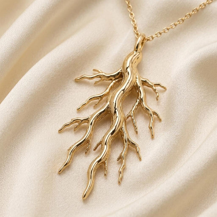 Gold Plated Silver Sacred Root Necklace with branching root pendant on cream satin