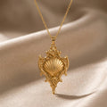 Gold Plated Silver Sacred Shell Relic pendant necklace with a raised fan-shaped shell on champagne satin