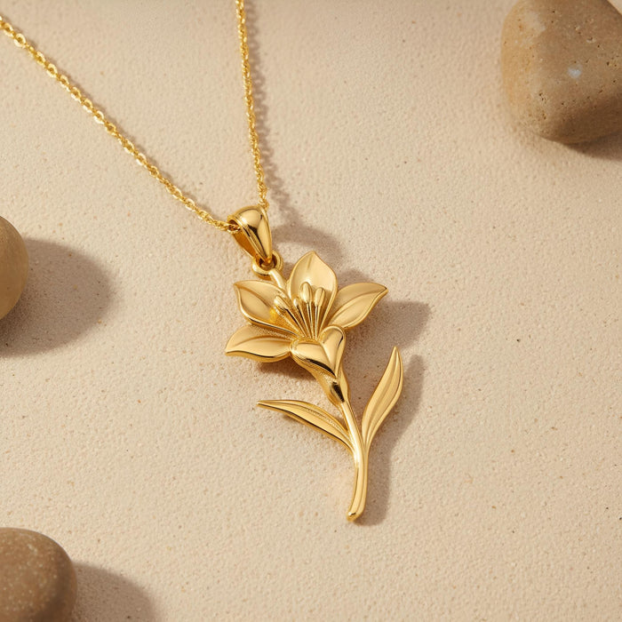 Flat lay of the Gold Plated Silver Saffron Flower Pendant Necklace showing the raised flower center and two leaves