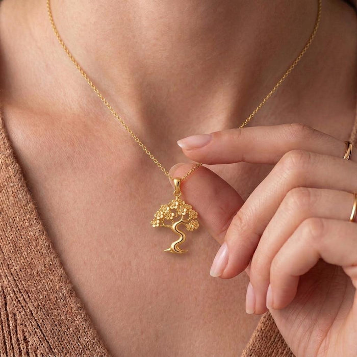 Close-up worn view of the Gold Plated Silver Sakura Cloud Bonsai Necklace