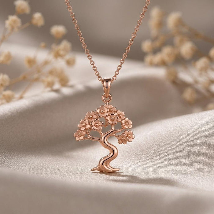 Rose Gold Plated Sakura Cloud Bonsai Necklace with clustered blossom canopy on neutral fabric