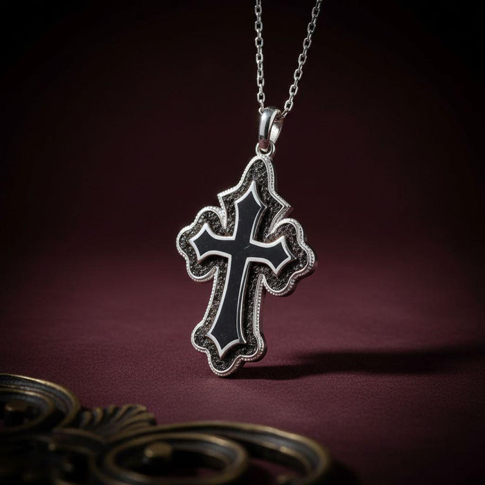 Front view of the Onyx Cross Pendant Necklace against a burgundy background
