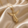 Gold Plated Silver sculpted angel pendant necklace with feather-detailed wings on champagne satin