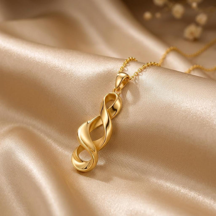 Gold Plated Silver Sculptural Ribbon Necklace with three overlapping open loops on champagne satin