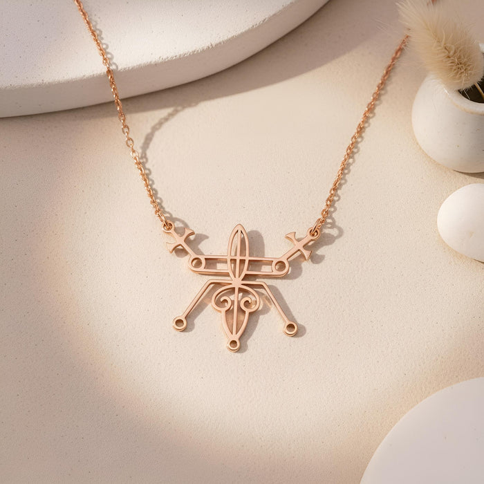 Rose Gold Plated Seal of Beelzebub necklace on a neutral textured surface