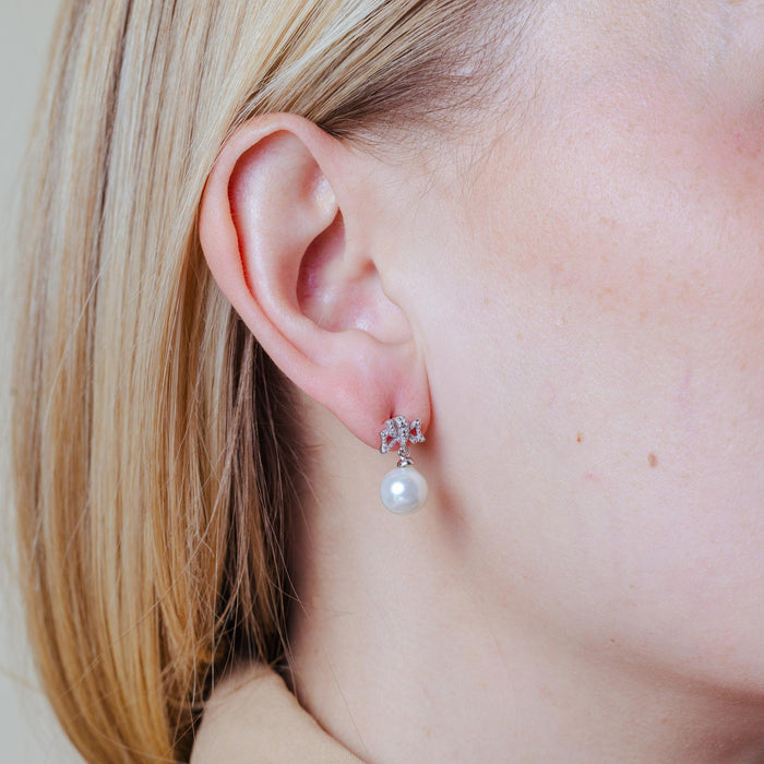 Silver 925 Rhodium Plated Ribbon CZ Hanging Pearl Stud Earrings - BGE00421 | Silver Palace Inc.