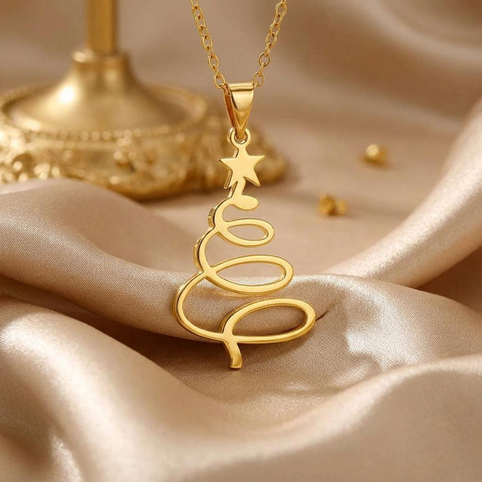 Gold Plated Silver open spiral Christmas tree pendant with star detail on champagne satin