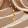 Gold Plated Silver Statice Flower Pendant Necklace with a textured floral sprig on champagne satin