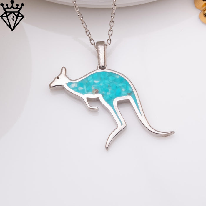 Turquoise inlay kangaroo pendant on a white display surface
