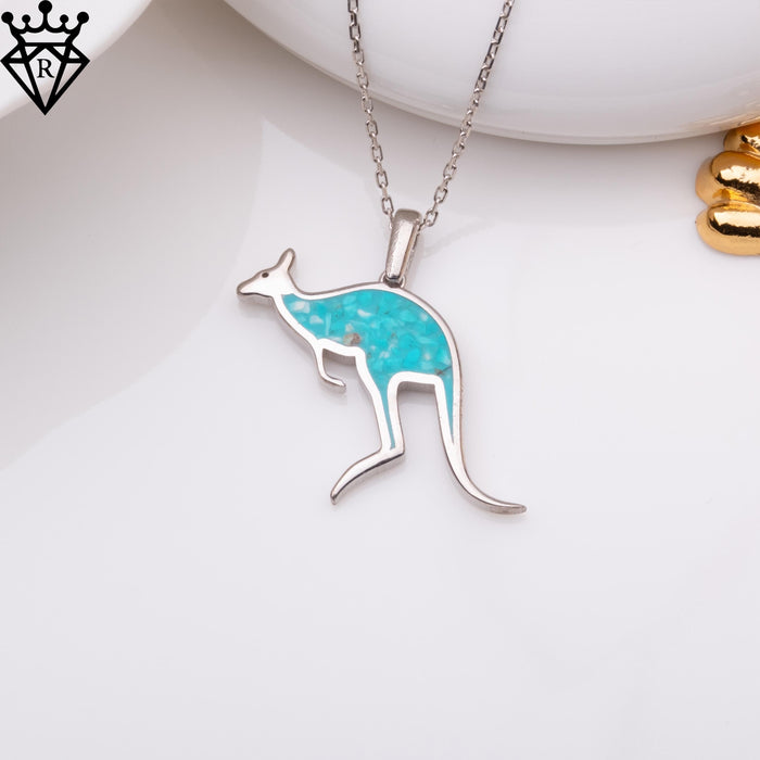 Front view of the turquoise inlay kangaroo pendant on a white display surface, catalog view 5