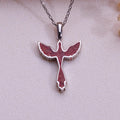 Sunstone jasper dove pendant necklace in 925 sterling silver on pale fabric