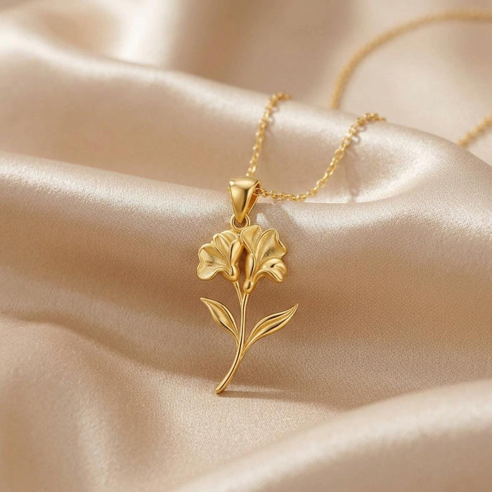 Gold Plated Silver Sweet Pea Flower Pendant Necklace on champagne fabric