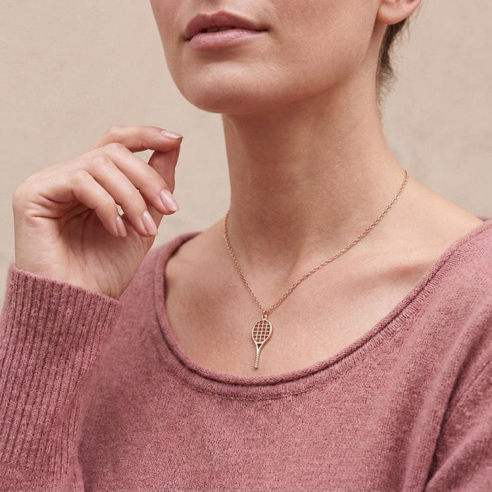 Rose Gold Plated Tennis Racket Necklace worn over a dusty pink knit top