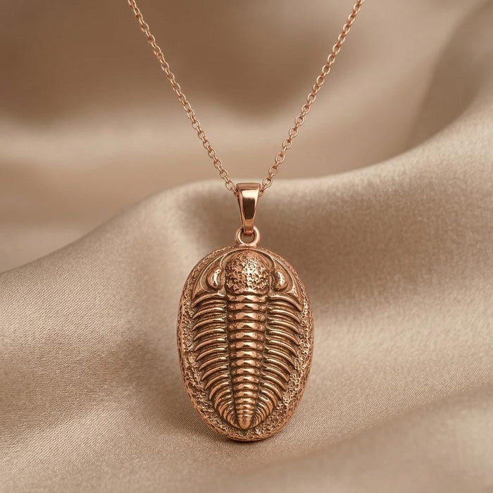 Rose Gold Plated trilobite pendant necklace close-up showing the raised segmented relief