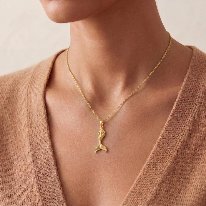 Close view of the Gold Plated Silver Mermaid Tail Silhouette Necklace worn at the center of the chest