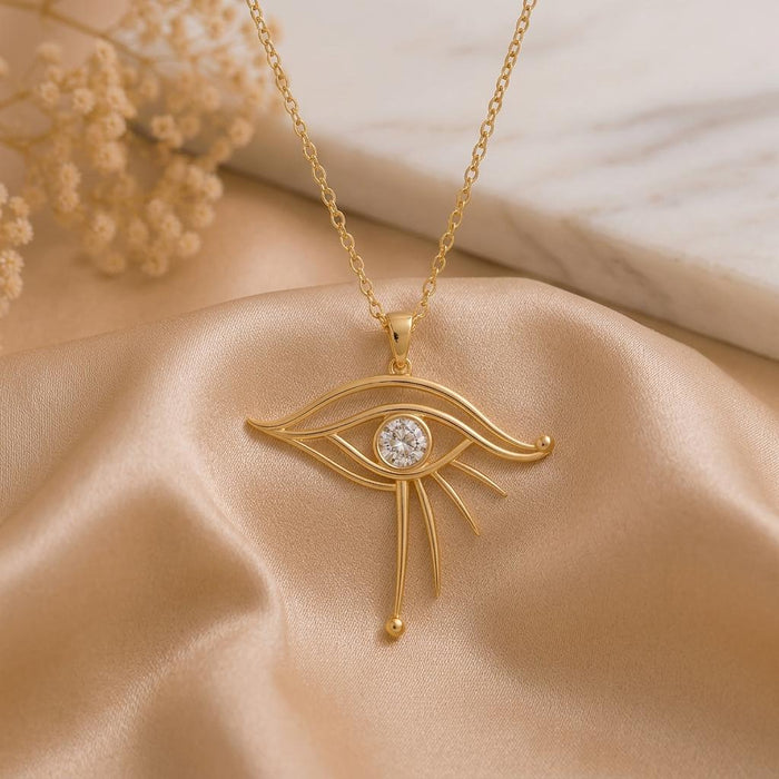 Gold Plated Silver Celestial Eye Pendant with double upper curves, round center detail, and three lower rays on champagne satin