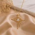 Gold Plated Silver Celestial Eye Pendant with double upper curves, round center detail, and three lower rays on champagne satin