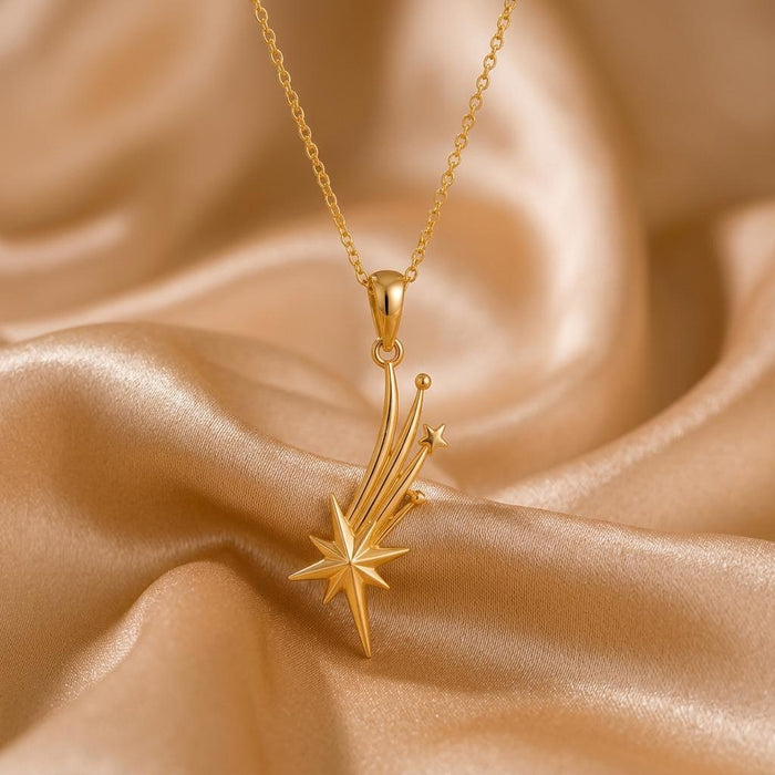Gold Plated Silver Falling Star Pendant Necklace with curved star trails on champagne satin