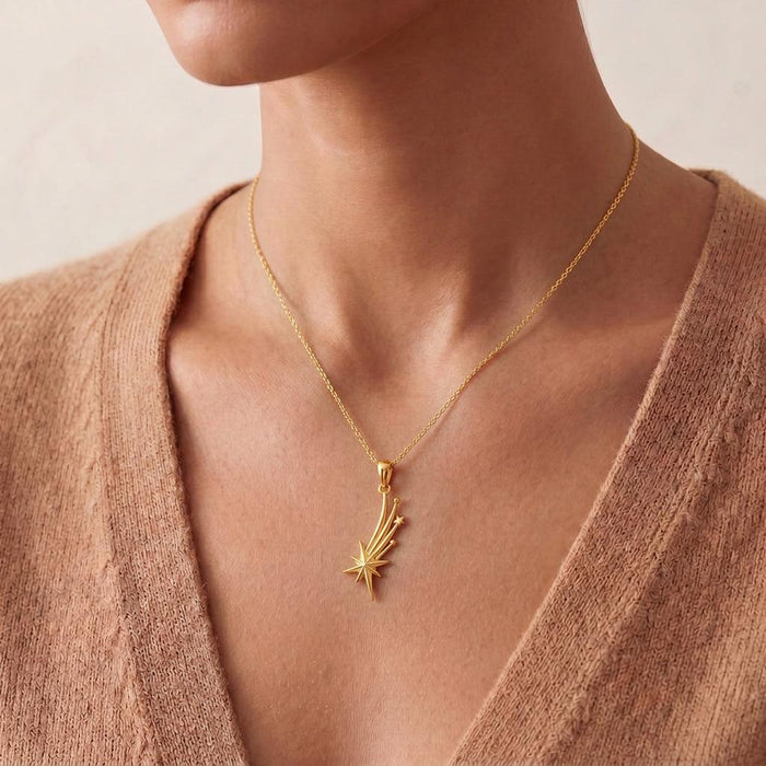 Close neckline view of a Gold Plated Silver Falling Star Pendant Necklace