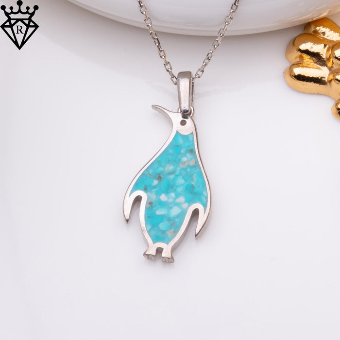 Pendant detail showing the penguin eye, outlined flippers and small feet