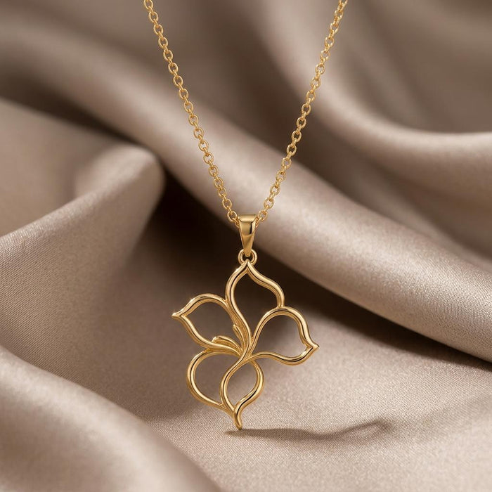 Gold Plated Silver four-petal openwork Velvet Petal Pendant Necklace on draped satin