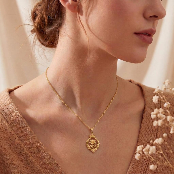 Side-profile model view wearing the Gold Plated Silver crown-topped floral pendant with dried flowers in the foreground